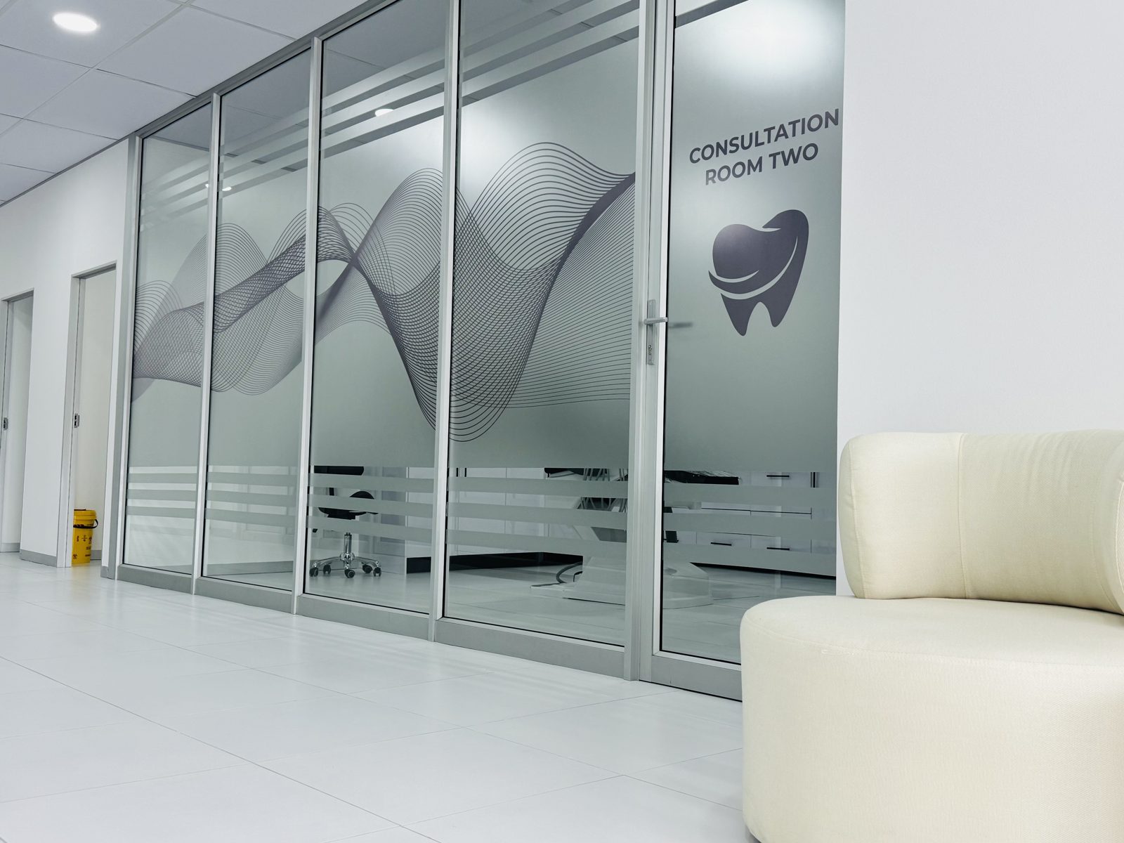 Ultra Smile Dental Studio glass-partitioned consultation room two