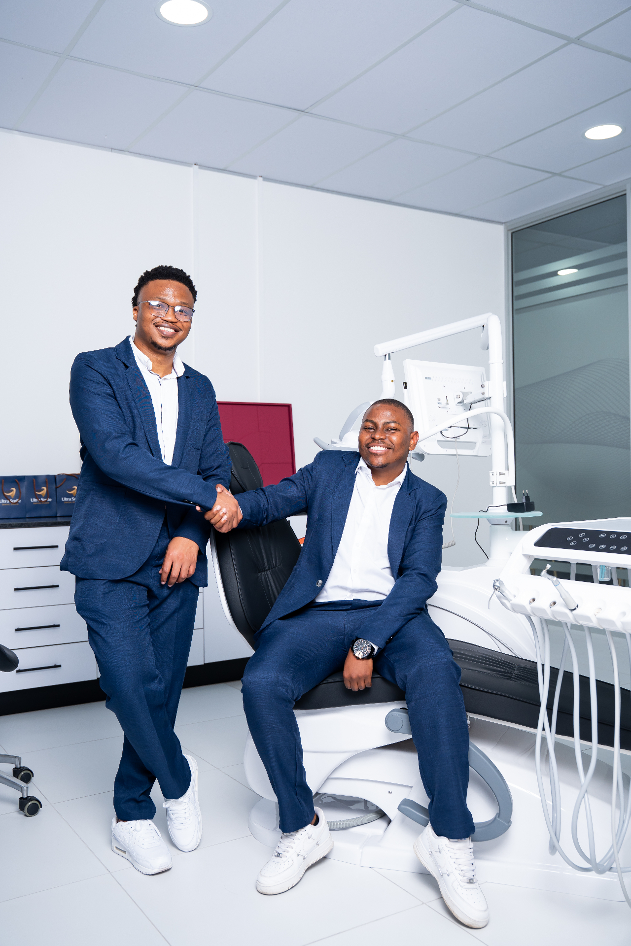 Ultra Smile Dental Studio dentists at the dental chair